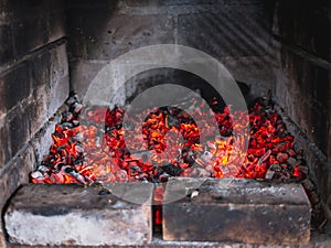 Smoldering embers, hot red fire