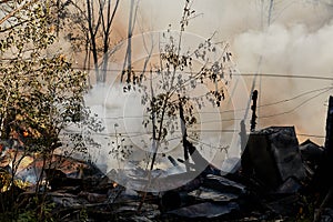 Smoldering pieces and charred wood