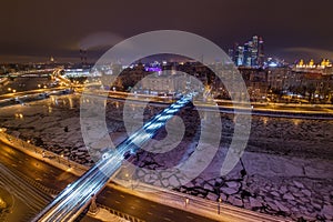 Smolensky Metro Bridge and river with ice at night photo