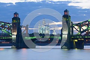 Smolny Cathedral in the alignment of Peter the Great bridge in May twilight. Saint-Petersburg, Russia