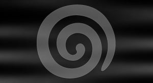 A smooth, abstract black background with soft, wavy patterns creating a subtle gradient effect. The