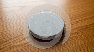 Smooth and appears to be made of a solid material, contrasting with