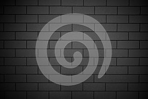 Smooth black brick wall concrete background horizontal, architecture
