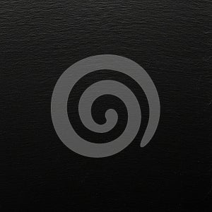 A smooth black textured surface with subtle horizontal grain patterns. The texture is