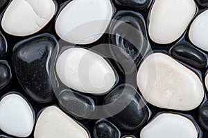Smooth black and white river stones