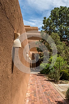 Smooth brown walls of a building in the Southwestern architecture style in Santa Fe, New Mexico