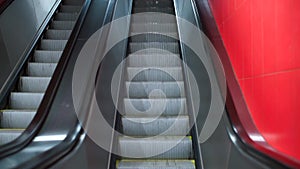 Smooth camera movement up the escalator.