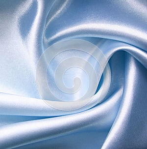 Smooth elegant blue silk as background