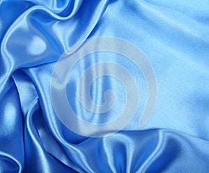 Smooth elegant blue silk as background