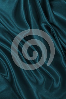 Smooth elegant blue silk or satin luxury cloth texture as abstract background. Luxurious background design