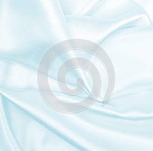 Smooth elegant blue silk or satin luxury cloth texture as abstract background. Luxurious background design