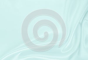 Smooth elegant blue silk or satin luxury cloth texture as abstract background. Luxurious background design