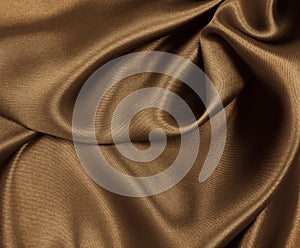 Smooth elegant brown silk or satin texture as abstract background. Luxurious background design. In Sepia toned. Retro style