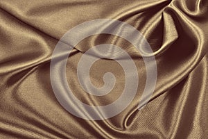 Smooth elegant brown silk or satin texture as abstract background. Luxurious background design. In Sepia toned. Retro style