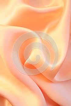 Smooth elegant golden pink silk as background