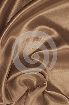 Smooth elegant golden silk as background. In Sepia toned. Retro