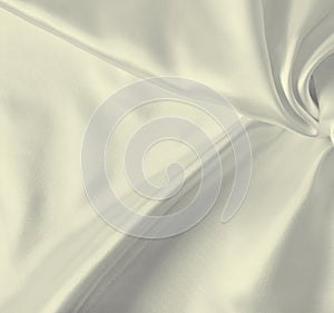 Smooth elegant golden silk as background. In Sepia toned. Retro