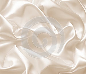 Smooth elegant golden silk as wedding background. In Sepia toned