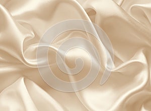 Smooth elegant golden silk as wedding background. In Sepia toned