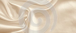 Smooth elegant golden silk as wedding background. In Sepia toned