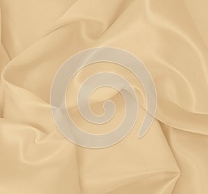 Smooth elegant golden silk or satin luxury cloth texture as wedding background. Luxurious background design. In Sepia toned.