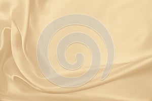 Smooth elegant golden silk or satin luxury cloth texture as wedding background. Luxurious background design. In Sepia toned.