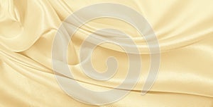 Smooth elegant golden silk or satin luxury cloth texture as wedding background. Luxurious background design. In Sepia toned.
