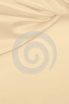 Smooth elegant golden silk or satin luxury cloth texture as wedding background. Luxurious background design. In Sepia toned. Retro