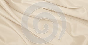 Smooth elegant golden silk or satin luxury cloth texture as wedding background. Luxurious background design. In Sepia toned. Retro