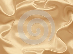 Smooth elegant golden silk or satin texture as background. In Se