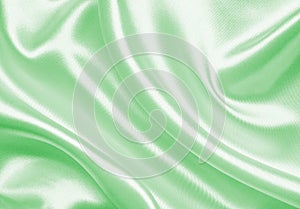 Smooth elegant green silk or satin as background