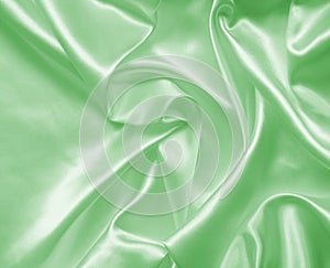 Smooth elegant green silk or satin texture as background