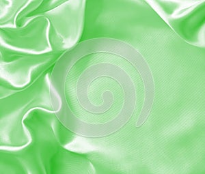 Smooth elegant green silk or satin texture as background