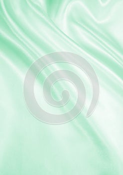 Smooth elegant green silk or satin texture as background