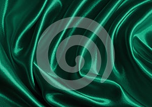 Smooth elegant green silk or satin texture as background