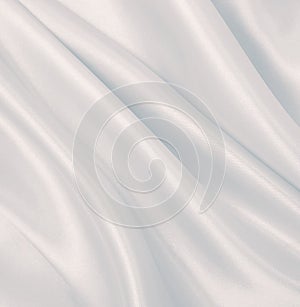 Smooth elegant grey silk or satin luxury cloth as wedding background. Luxurious background design