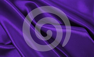 Smooth elegant lilac silk or satin luxury cloth texture as abstract background. Luxurious background design