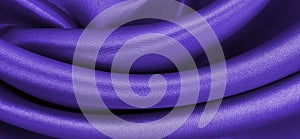 Smooth elegant lilac silk or satin luxury cloth texture as abstract background. Luxurious background design