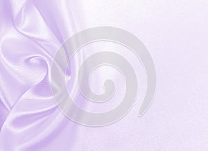 Smooth elegant lilac silk or satin texture as wedding background. Luxurious background design