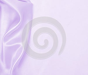 Smooth elegant lilac silk or satin texture as wedding background. Luxurious background design