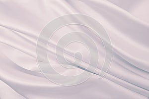 Smooth elegant lilac silk or satin texture as wedding background. Luxurious background design