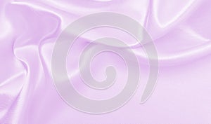 Smooth elegant lilac silk or satin texture as wedding background. Luxurious background design