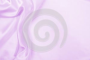 Smooth elegant lilac silk or satin texture as wedding background. Luxurious background design