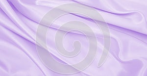 Smooth elegant lilac silk or satin texture as wedding background. Luxurious background design