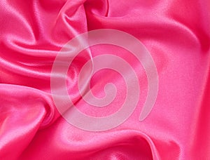 Smooth elegant pink silk or satin as background