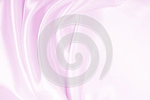 Smooth elegant pink silk or satin texture as wedding background. Luxurious background design