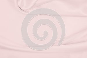 Smooth elegant pink silk or satin texture as wedding background. Luxurious background design