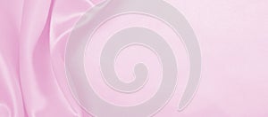 Smooth elegant pink silk or satin texture as wedding background. Luxurious background design