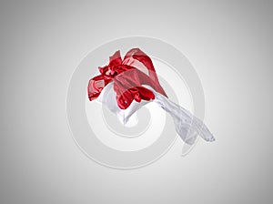 Smooth elegant transparent red and white cloth separated on gray background.