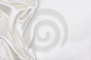 Smooth elegant white silk or satin luxury cloth texture as wedding background. Luxurious background design